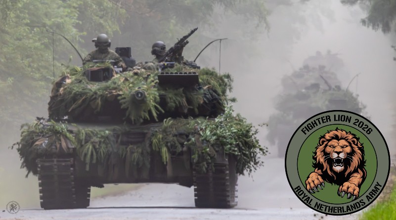 Tank over de weg en logo van de oefening